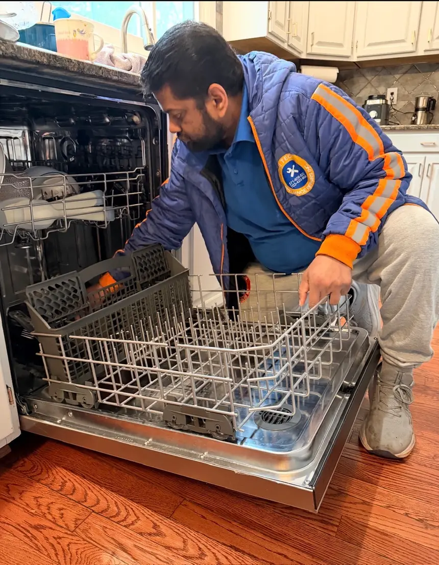 Hi-Tech technician repairing a dishwasher in a Northern Virginia kitchen
