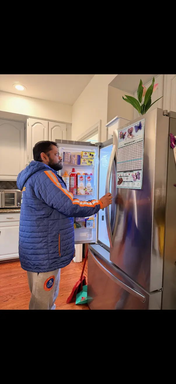 Hi-Tech technician servicing a French-door refrigerator in Northern Virginia
