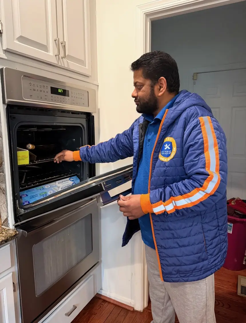Hi-Tech technician repairing a wall oven in Northern Virginia